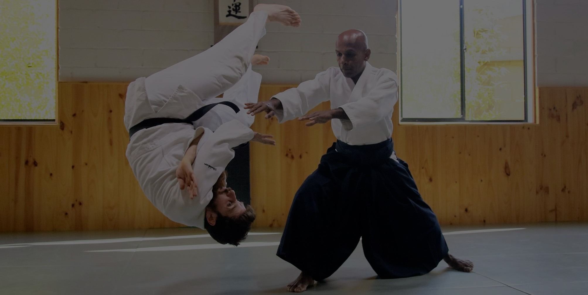 Sensei Joe executes a throw showing zanshin